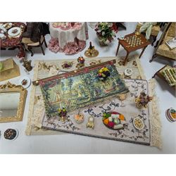 Dolls house living room and dining room furniture, including arm chairs, desk, fireplaces, dressers, tables, eight figures and a large collection of predominantly Christmas themed food, accessories and decorations