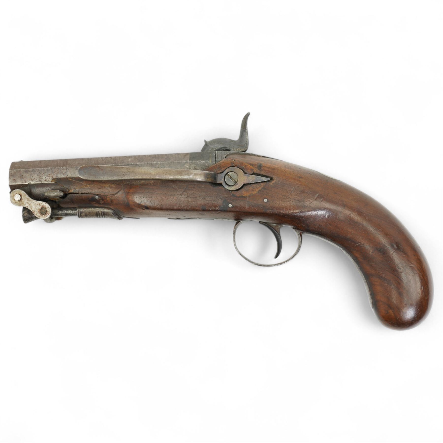 19th century percussion pistol with octagonal barrel, captive ramrod, belt hook, scroll engraved lock and trigger guard and walnut stock L25cm  