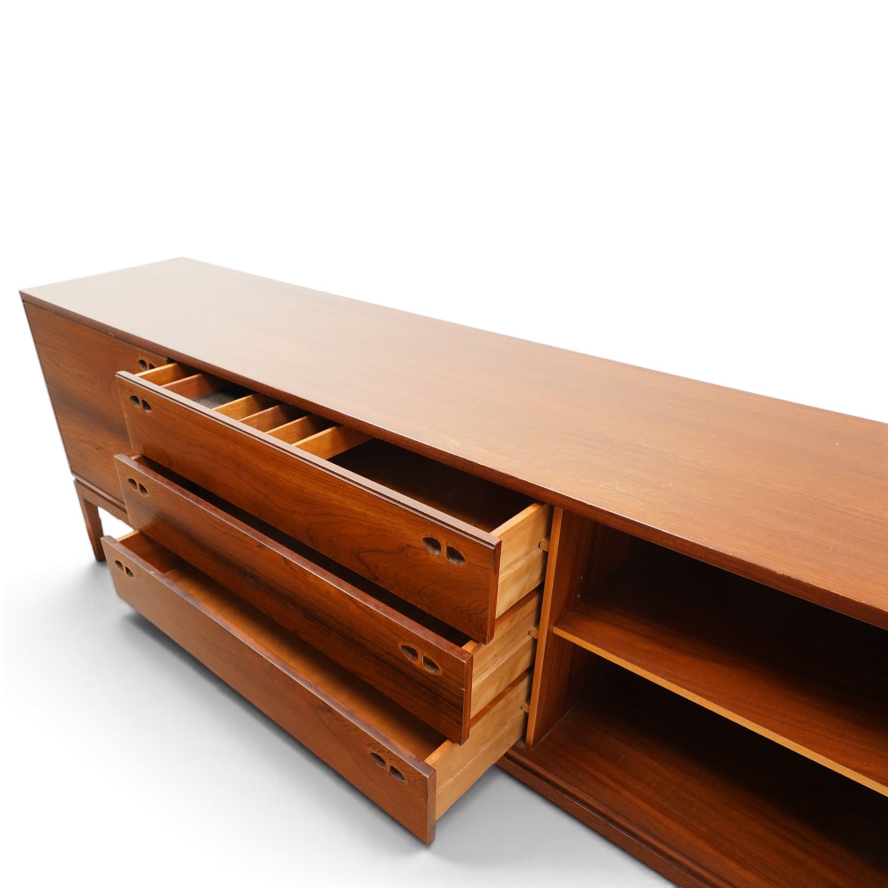 Robert Heritage (1927-2008) for Archie Shine - Large rosewood sideboard, with a central bank of three drawers flanked by a cupboard either side, raised on square tapering supports