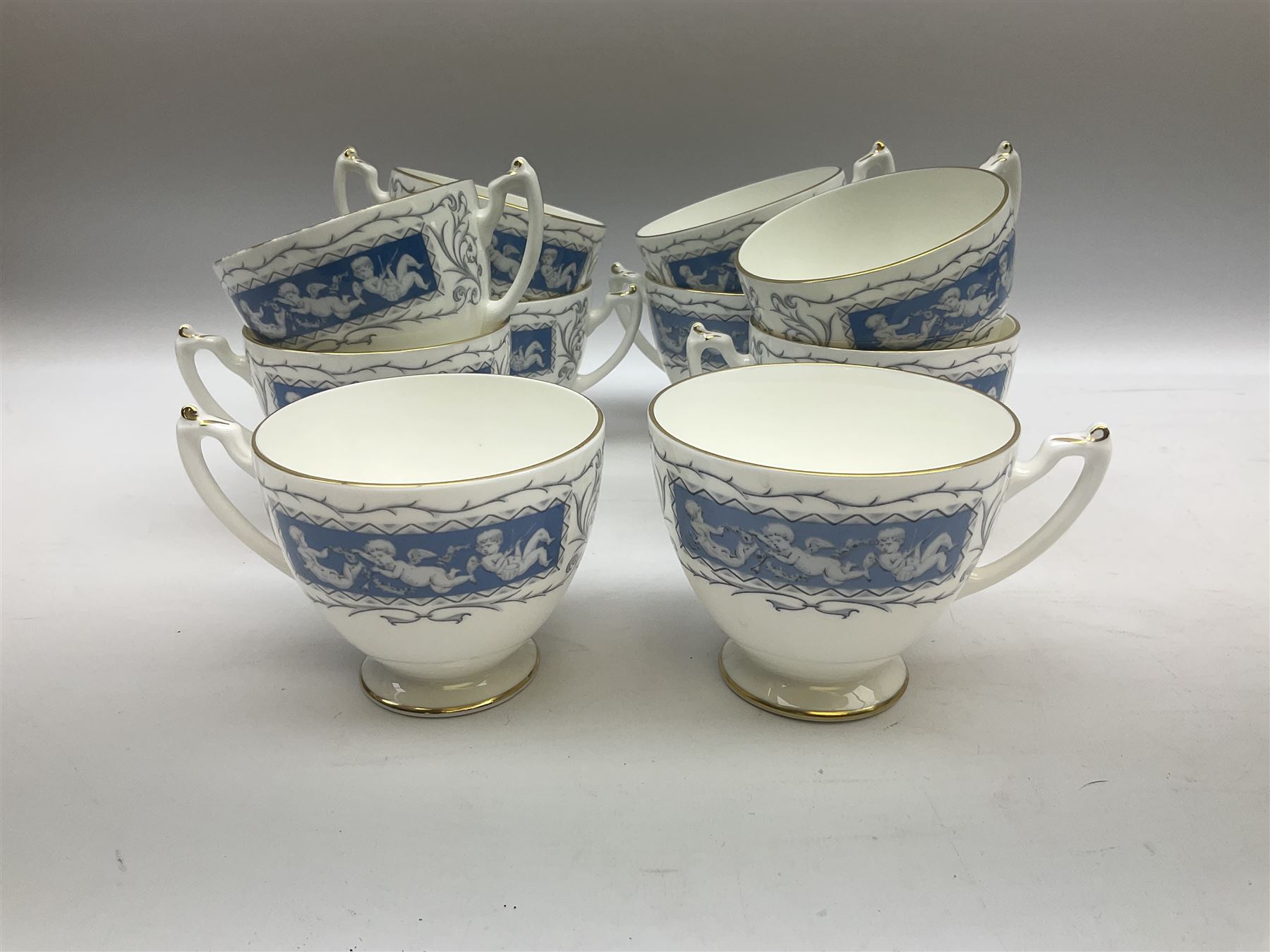 Coalport Revelry pattern tea and dinner wares, comprising nine dinner plates, four salad plates, eleven side plates, sauce boat and stand, ten teacups and ten saucers, and preserve pot and cover, together with a Coalport plate of shaped form decorated with pink roses, and a Royal Crown Derby Royal Antoinette pattern trio