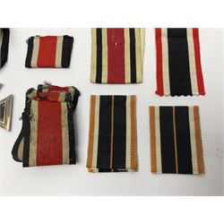 WWII German Iron Cross 2nd Class, the suspension ring stamped 128 for S. Jablonski G.m.b.H. Posen; with ribbon; together with an embroidered cloth eagle badge and quantity of German medal ribbons.