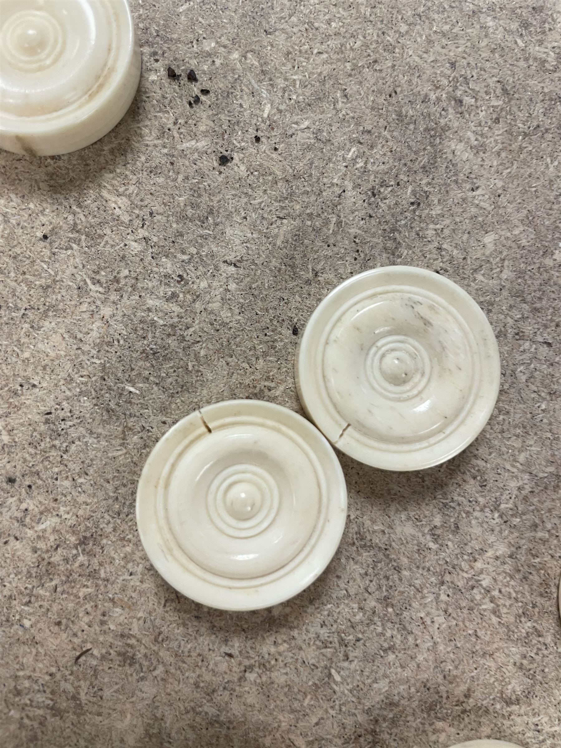 19th century walnut and brass bound games compendium box, painted to enhance the grain, of rectangular form, the hinged opening cover with rounded sides, central brass cartouche with engraved lion crest, and brass riveted straps, opening to reveal a red leather and blue silk lined compartmented interior, with fold-down games board, and lift-out tray containing playing cards, ebony turned dice towers, white and red stained bone draughts, and chess pieces, ivory dice, and ivory and ebony whist markers, and brass bezique board, cribbage board and markers, H15cm W32cm D24cm
This lot has been registered for sale under Section 10 of the APHA Ivory Act