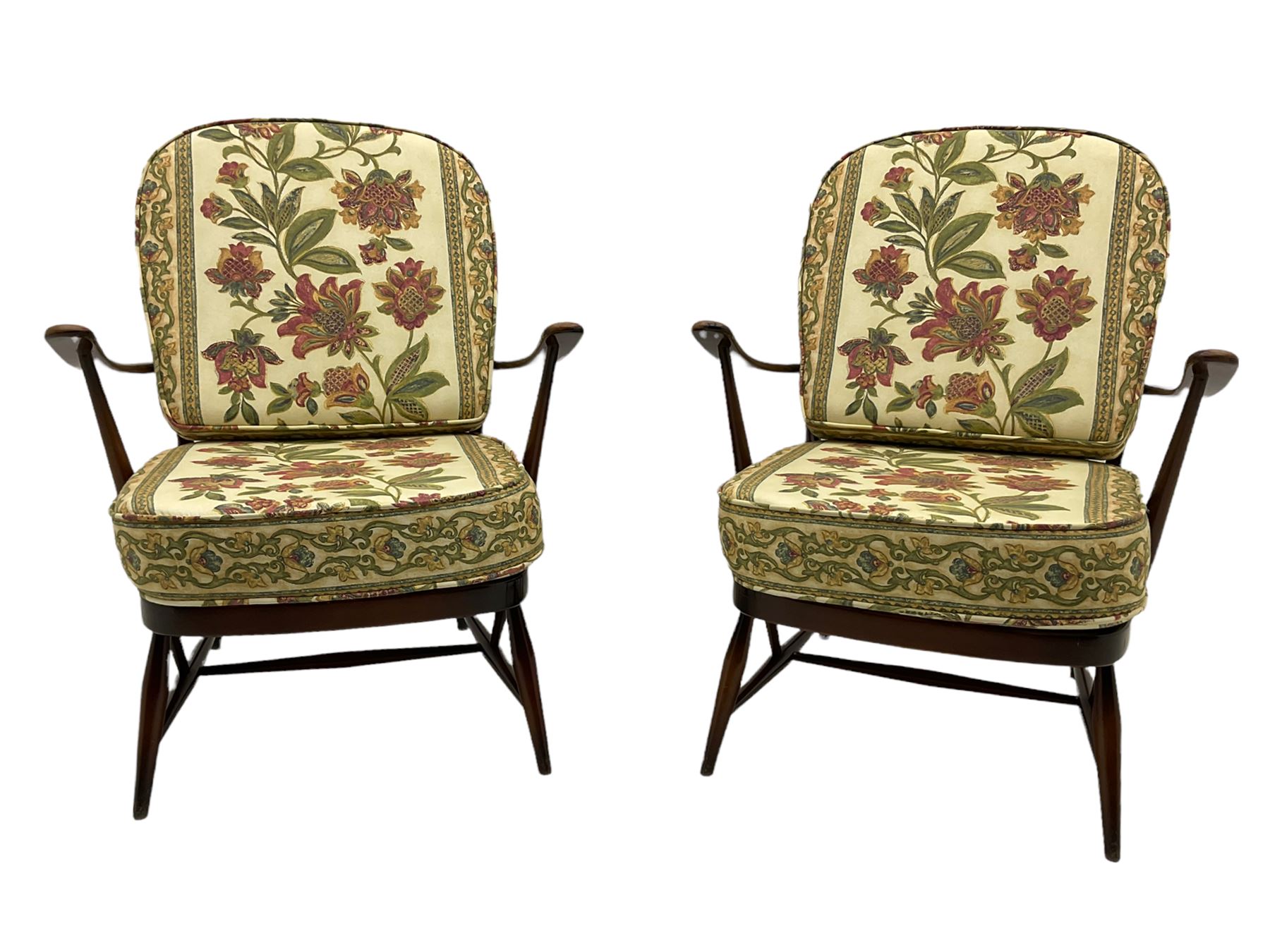 Ercol - Pair of mid-20th centur medium elm framed easy chairs, with loose patterned covers with folate design