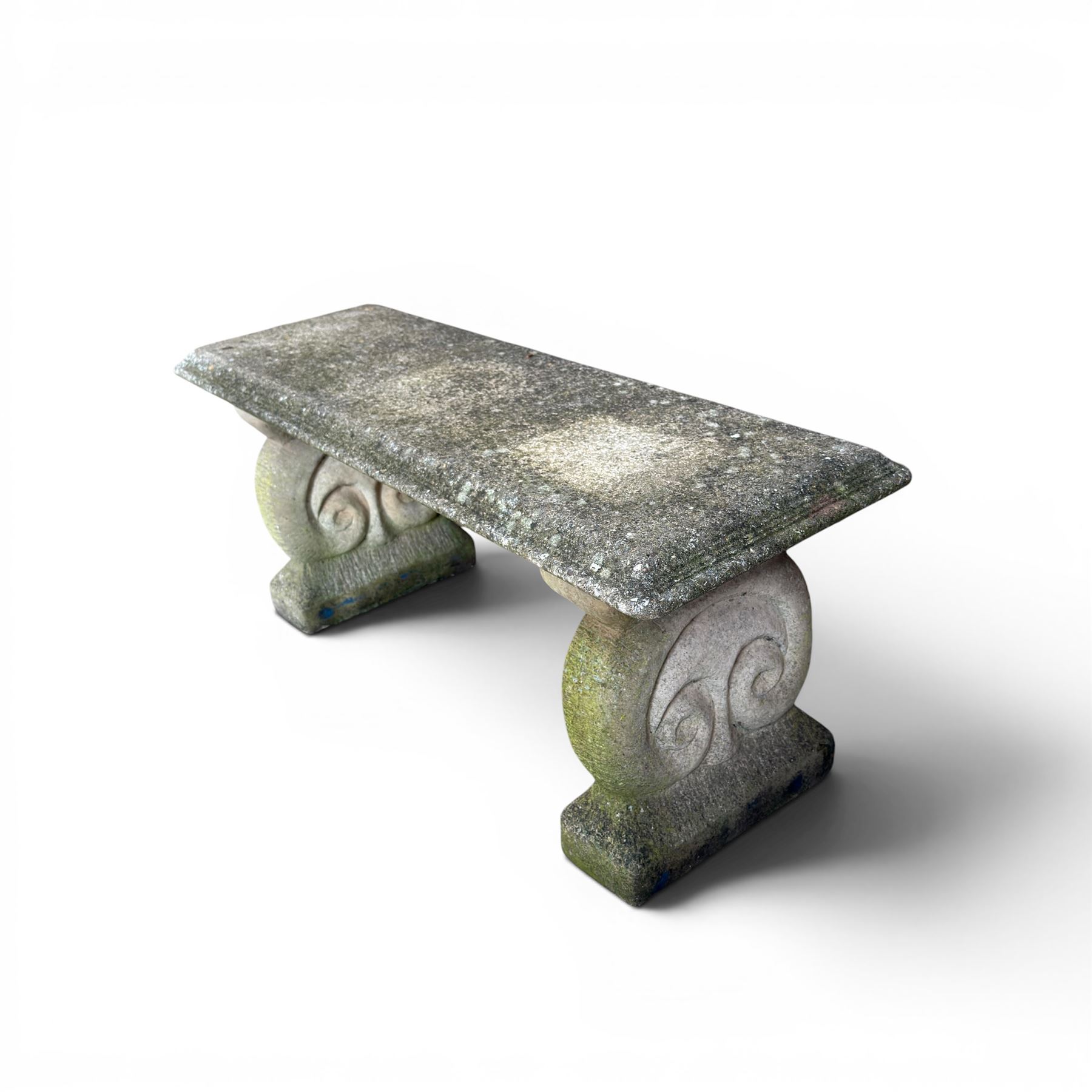 Three piece weathered cast stone garden bench, rectangular top on rounded detailed base