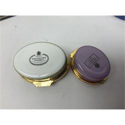 Halcyon Days bonbonniere, modelled as pink roses in a planter painted with a blue and white Japanese scene, together with five Halcyon Days enamel boxes, one a larger example depicting 'The Becket Casket' and four smaller boxes, including The 1993 Easter Egg, Happy Birthday and Statue of Liberty examples, all boxed, Becket Casket D8cm