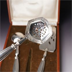 Scandinavian white metal three piece serving set comprising pastry slice, sauce ladle and sifting spoon with fluted handles, cased