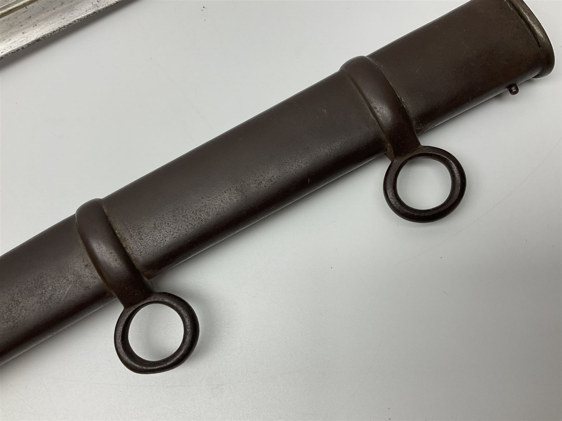 19th Century German (Saxony) Cavalry Sword, the 90.5cm single edge curved steel blade with narrow fuller to the back edge at each side, engraved with a crowned AR monogram and coat of arms, stamped with crowned AR, the back edge engraved C.v Keller im Solingen 1862, the brass half basket hilt with three flat curved bars, applied badge missing, marked G.R. 4, with ribbed leather covered grip and leather finger strap; in steel scabbard with two fixed suspension rings to one side and stamped G.R. II 118; L109.5cm overall