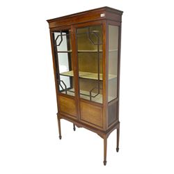 Edwardian inlaid mahogany display cabinet, fitted with two astragal glazed doors enclosing three shelves, raised on square tapering supports with spade feet