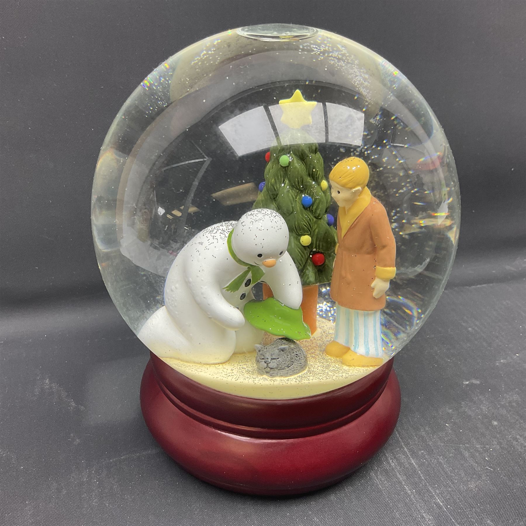 Coalport Characters The Snowman, comprising three snowglobes, Advent calendar, bookend and money box  