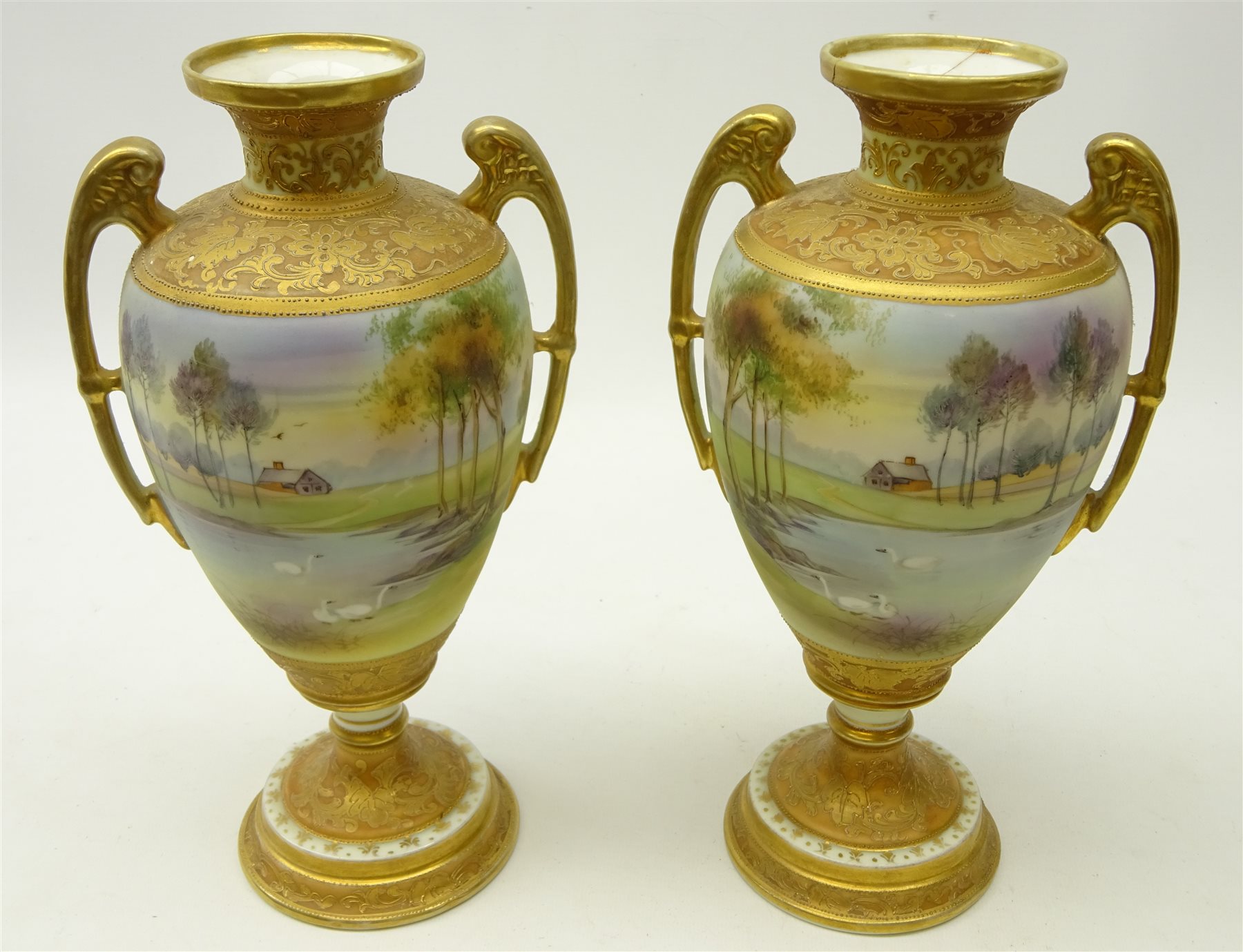 Pair Nippon type urn shaped vases, hand painted with a lake scene