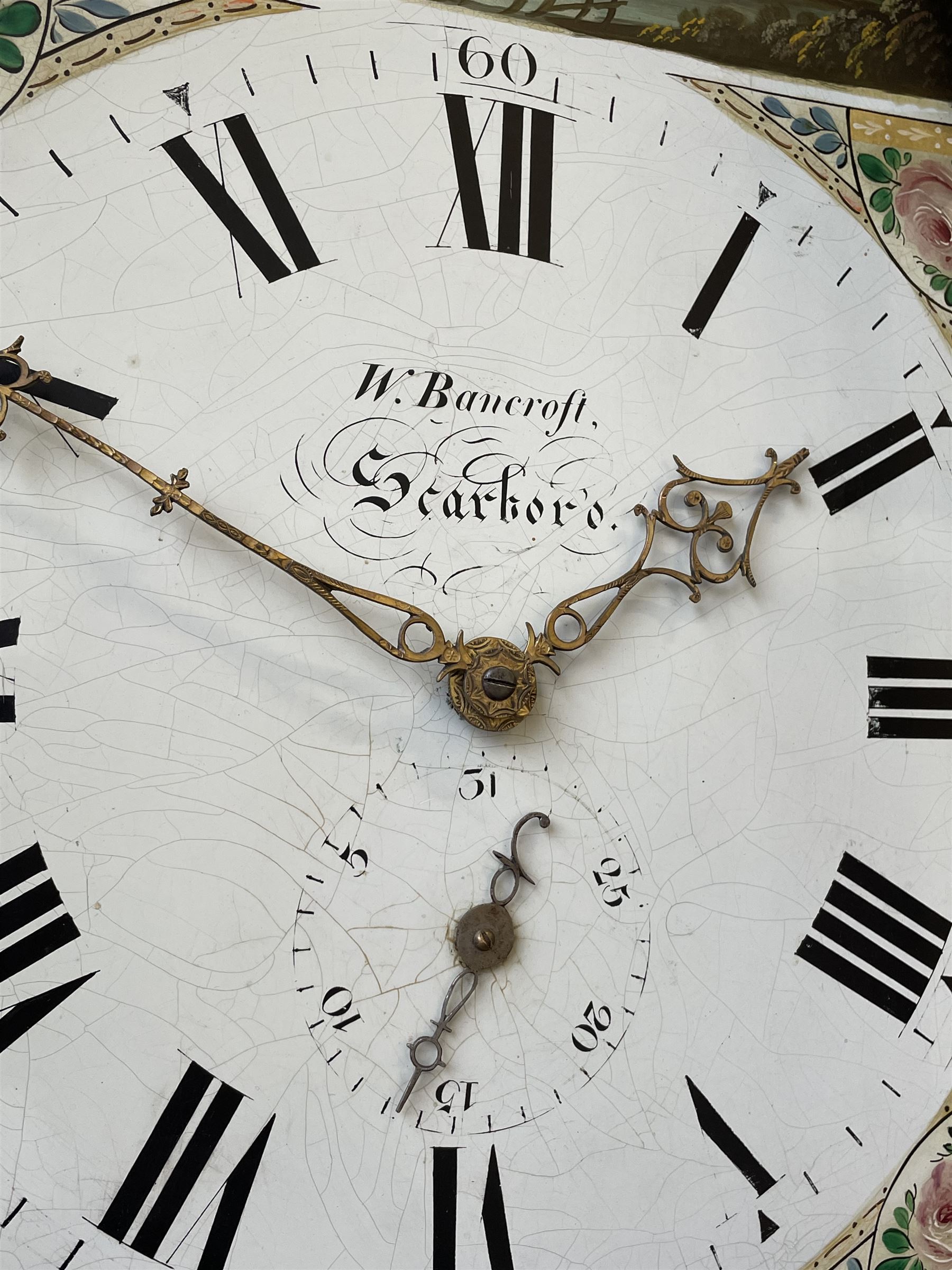 Thirty-hour oak cased longcase clock by  William Bancroft of Scarborough circa 1830, with a swan’s neck pediment, brass patera and three brass spire and ball finials, stepped break arch hood door flanked by plain pillars with brass capitals, trunk with a full length door and curved arch top, on a plain square plinth with bracket feet, painted break arch dial with roman numerals and quarter hour Arabic’s, date recorder (anti clockwise) and matching brass hands, arch painted with a rural scene depicting a ruined tower and cottage with depictions of flowers to the spandrels, dial pinned directly to a chain driven countwheel striking movement, striking the hours on a bell. With weight and pendulum. The Bancroft family were prodigious Scarborough clockmakers during the 18th and 19th century, William Bancroft is recorded as working in Newborough Street from 1820 onwards. 


