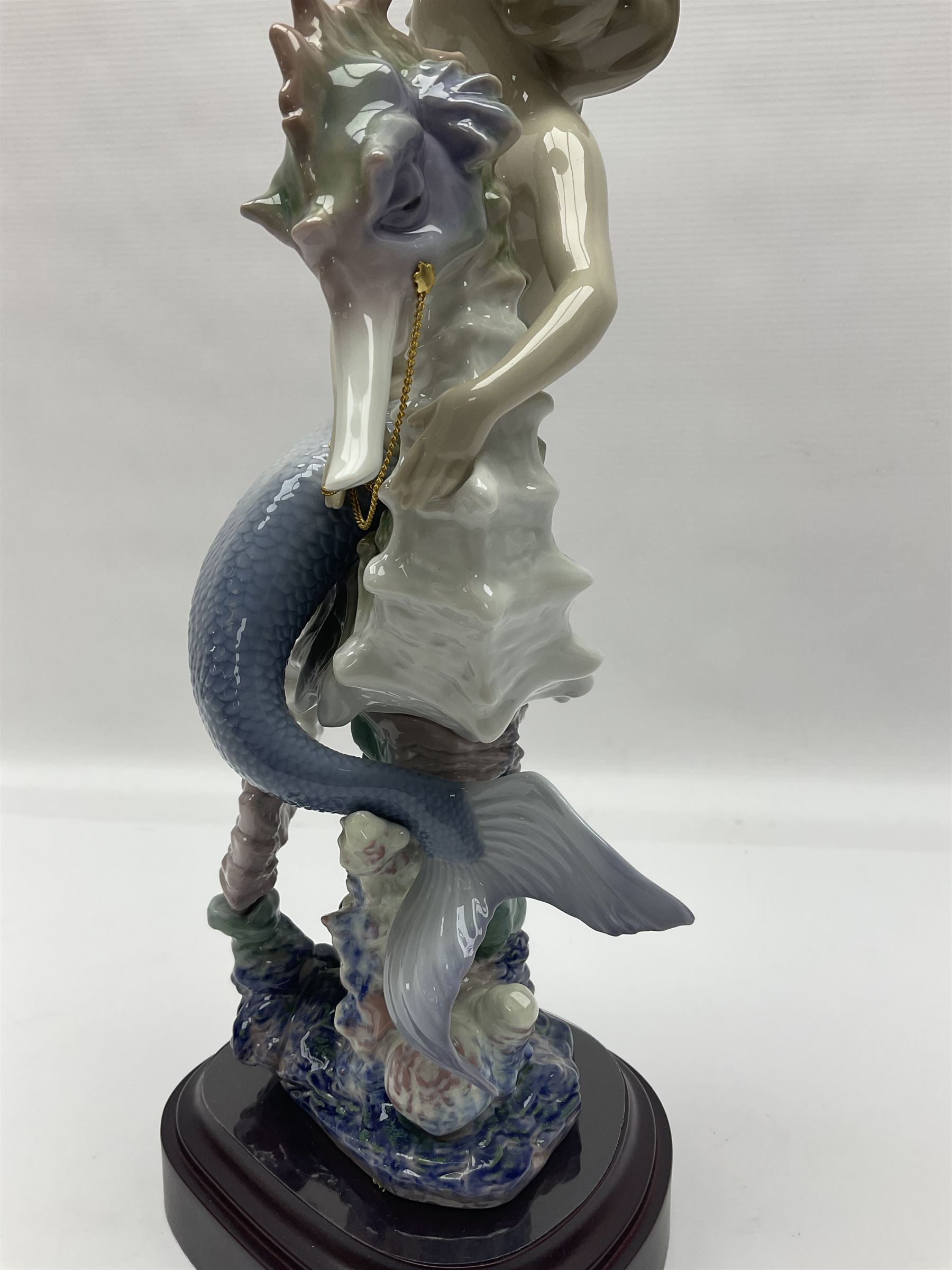 Lladro figure, Beneath the Waves, modelled as a mermaid and seahorse upon a wooden plinth, no 1822, limited edition 1389/2500, with certificate and original box, H32cm 