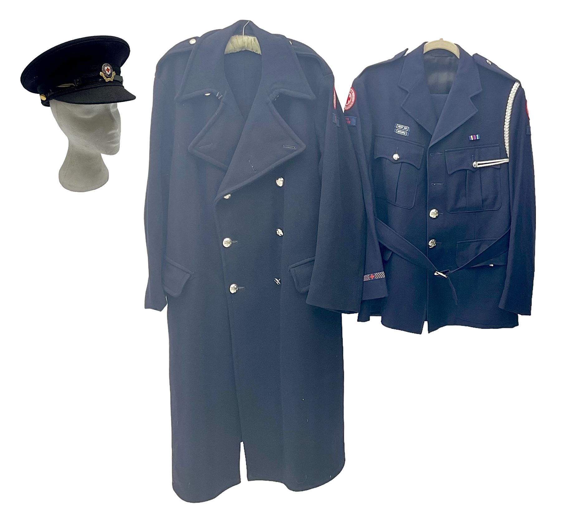 1950s British Red Cross North Yorkshire dress uniform comprising tunic, trousers, greatcoat and visor cap; bears manuscript label '1956 Ware'