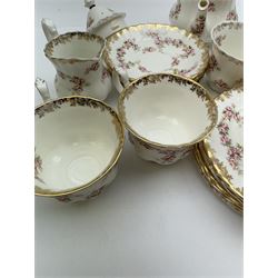 Royal Albert Dimity Rose pattern tea service for six place settings, including teapot, teacups and saucers, sugar bowl and two milk jugs, all with printed mark beneath