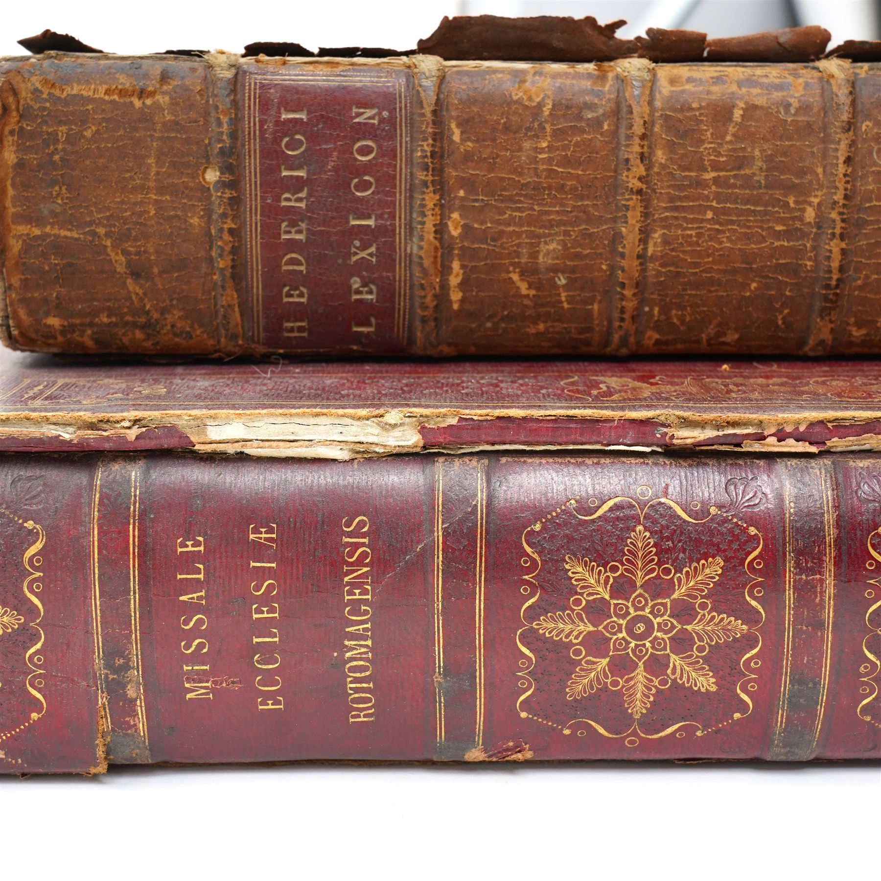 Missale Ecclesiae Rotomagensis published in Latin by Jore, father and son, by the authority of Louis de Lavergne of Tressan 1728, folio in gilt decorated full calf and with metal mounts and Graecum Lexicon Manuale published H Woodfall, London 1766 full calf (2)