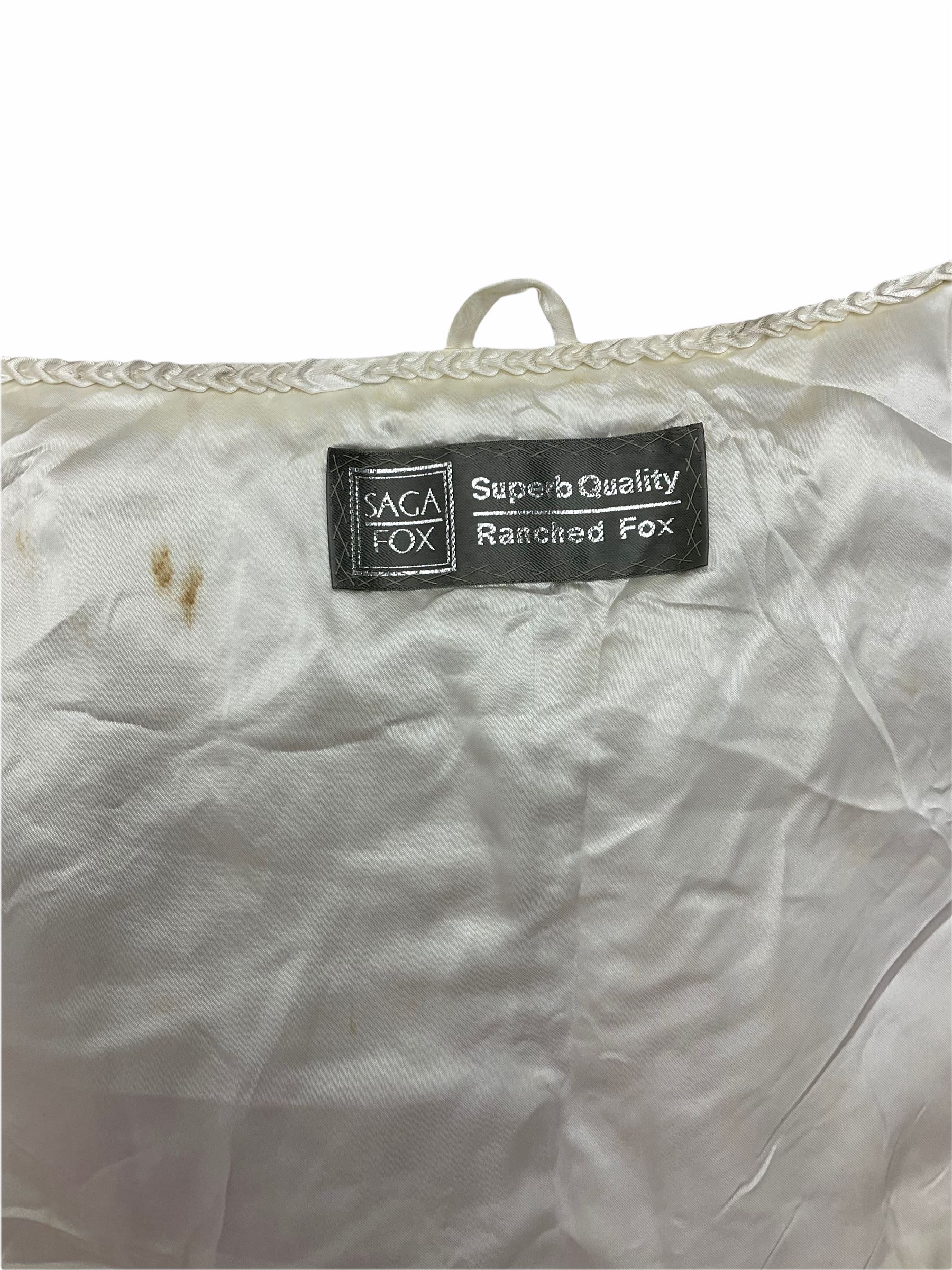 White Saga fox stole, together with Cresta Red fox fur hat, Red fox fur headband, a fur headband and matching cuffs, Harris Tweed clutch bag with fur trim, a fur clutch bag and an Ostrich feather and mohair scarf. 