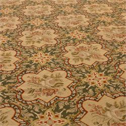 Late 20th-century Aubusson-style woven tapestry of rectangular form, woven with an all-over repeating arrangement of cream quatrefoil cartouches, each enclosing a stylized floral spray with an olive green scrolling foliate ground, interspersed with star motifs 