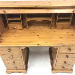 Solid pine twin pedestal shaped tambour roll top desk, fitted interior, eight drawers, shaped plinth base, W117cm, H111cm, D55cm