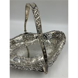 Edwardian silver swing handled basket, of navette form, with four repousse lion masks to each corner and with pierced and embossed floral, scroll and shell decoration to sides, base and handle, hallmarked Charles Horner, Birmingham 1906, height including handle H20cm