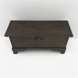  Small George lll planked oak coffer, hinged top with chip carved sides and brass nailed initials 'AE', on shaped bracket feet, W83cm, D32cm, H42cm  