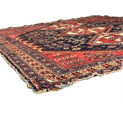 Persian Heriz wool rug, red and ivory field with floral medallion, geometric spandrels, and floral border (157cm x 107cm); Kurdish Shairwan wool rug, red and navy field with three medallions, geometric crosses and serrated border (200cm x 155cm); Persian Qashqai wool rug, golden-yellow field with boteh motifs and wide floral border (127cm x 82cm)