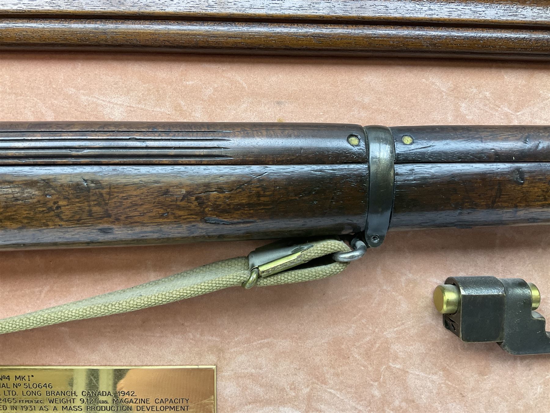 WW2 Lee Enfield No.4 Mk.1 .303 bolt-action rifle with hinged butt compartment, made by SA Ltd., Long Branch, Canada 1942, serial no.5L0646 L113cm; mounted on a framed display board with No.4 Mk.II spike bayonet, No.9 Mk.1 blade bayonet, two inert 5-round clips and brass biographical plaque by Antler Military Originals detailing DA Cert No.C3444 OLD STYLE DEACTIVATION SO FIREARMS CERTIFICATE REQUIRED OR RFD