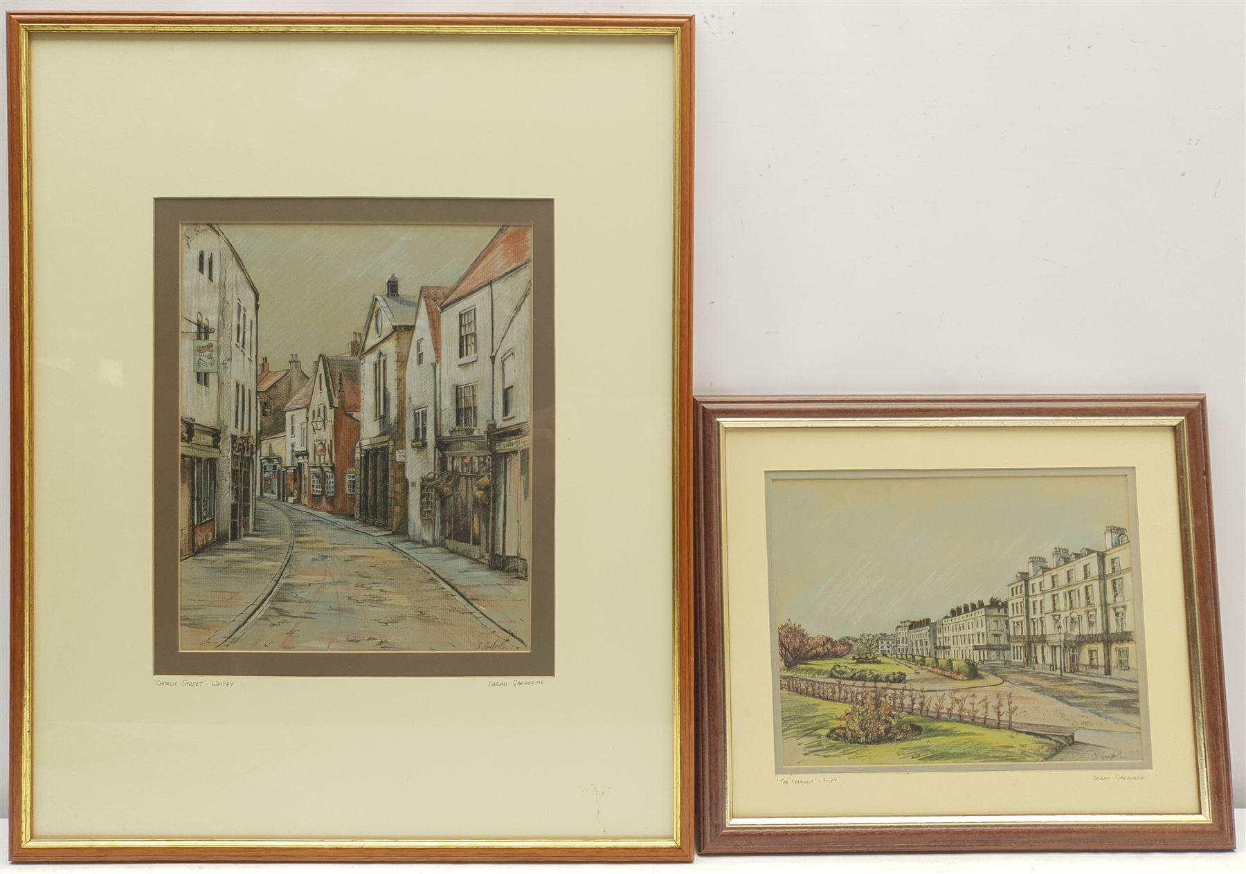 Sarah Garforth (British Contemporary): 'Church Street Whitby' and 'The Crescent Filey', two pastels and ink signed, titled on the mounts, further titled and dated June '93 on labels verso 27cm x 22cm and 18cm x 23cm (2)