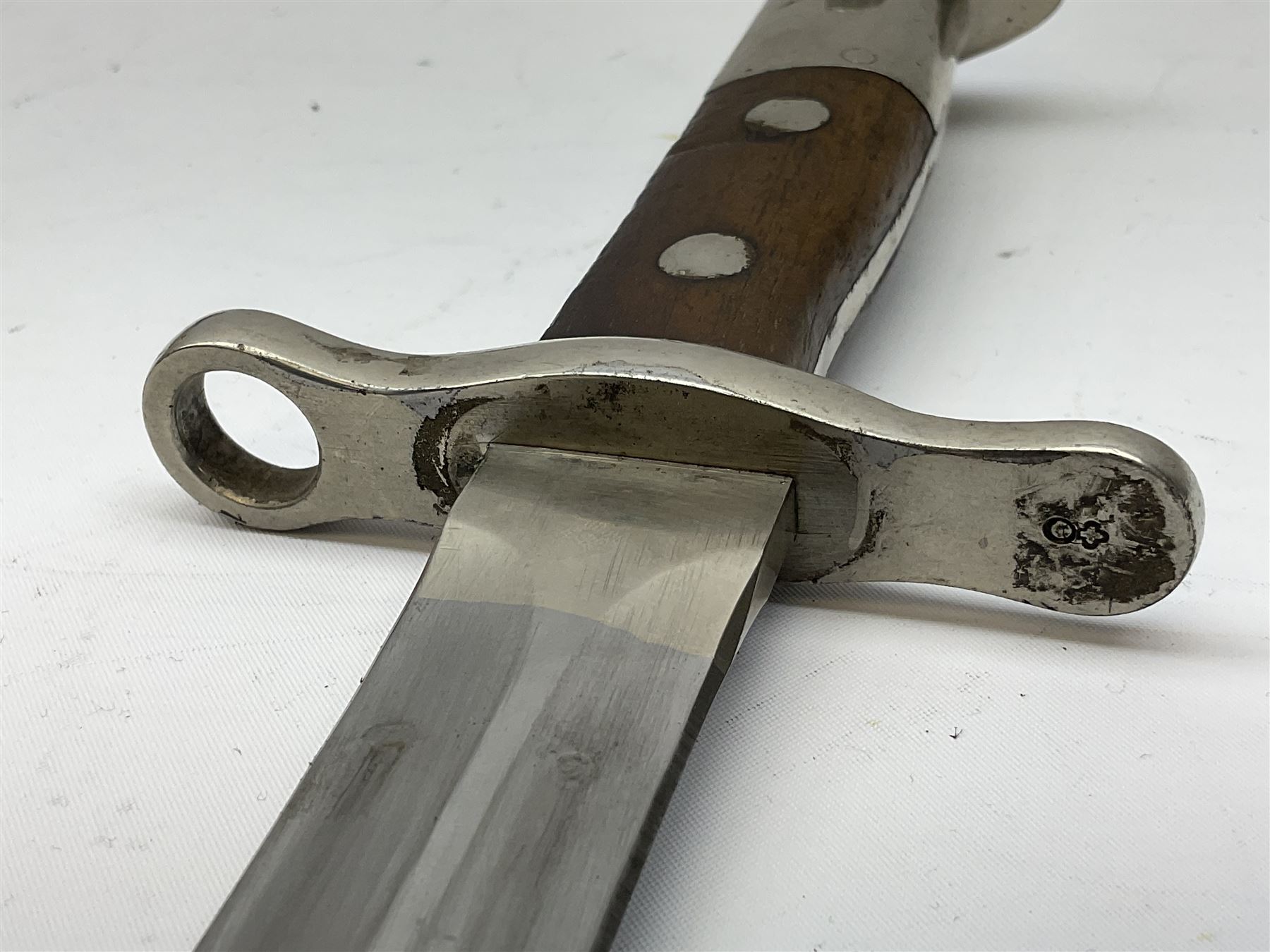 British Enfield 1907 model SMLE bayonet, with 43cm fullered steel blade and metal mounted leather scabbard L58cm overall; and Schmidt-Rubin Model 1918 bayonet the 30cm steel blade marked Elsener Schwyz No.579722; in steel scabbard with leather frog marked G. Bertolini Sellaio Vira/G.Tic 79 L45cm overall (2)