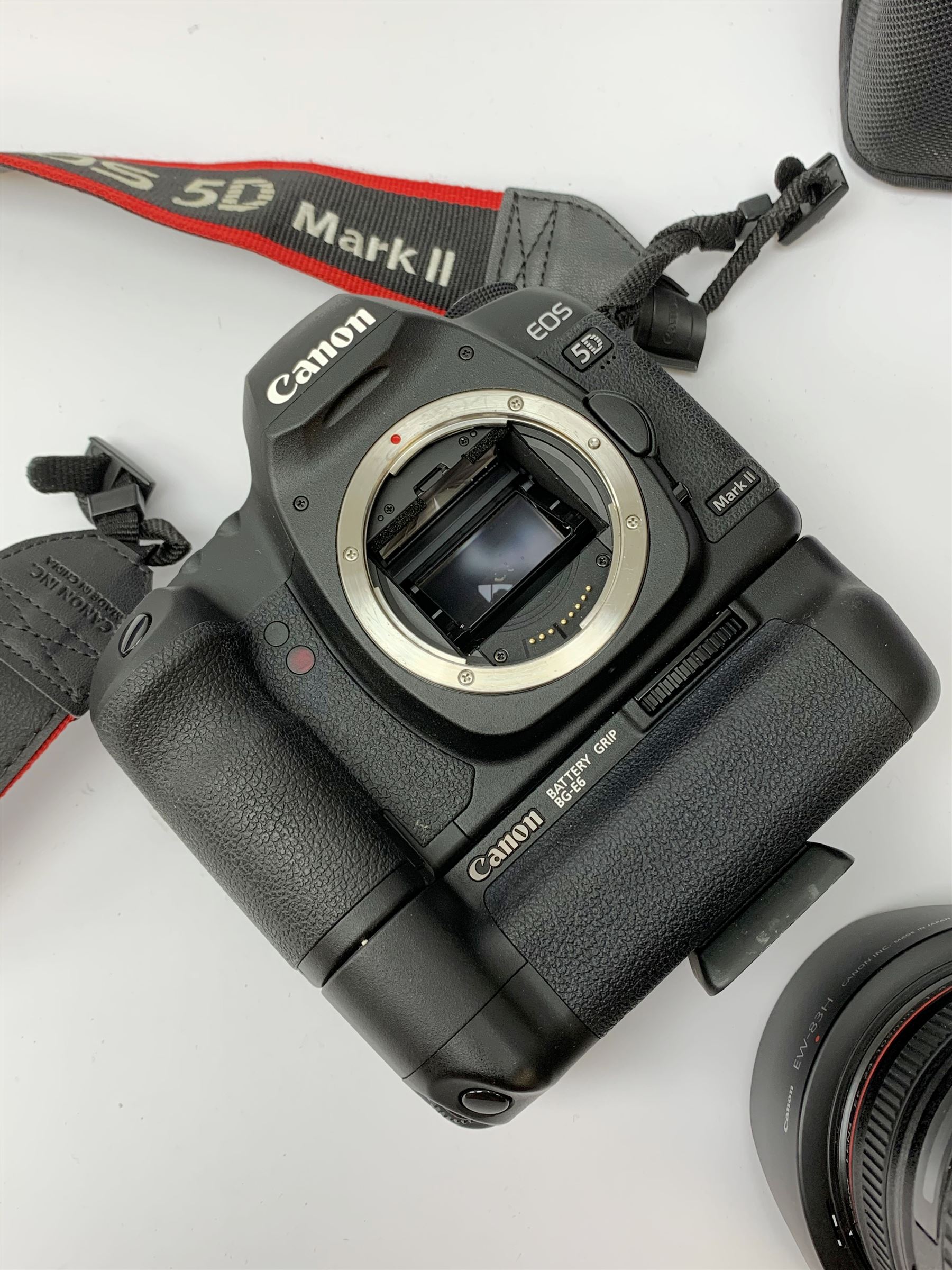 Canon EOS 5D camera body with Canon 'BG-E6' battery grip, Canon 'Speedlite 580EXII' flash and Canon lens 'Canon Zoom Lens EF 24-105mm 1:4 L IS USM' with Canon EOS 5D Mark II instruction manual