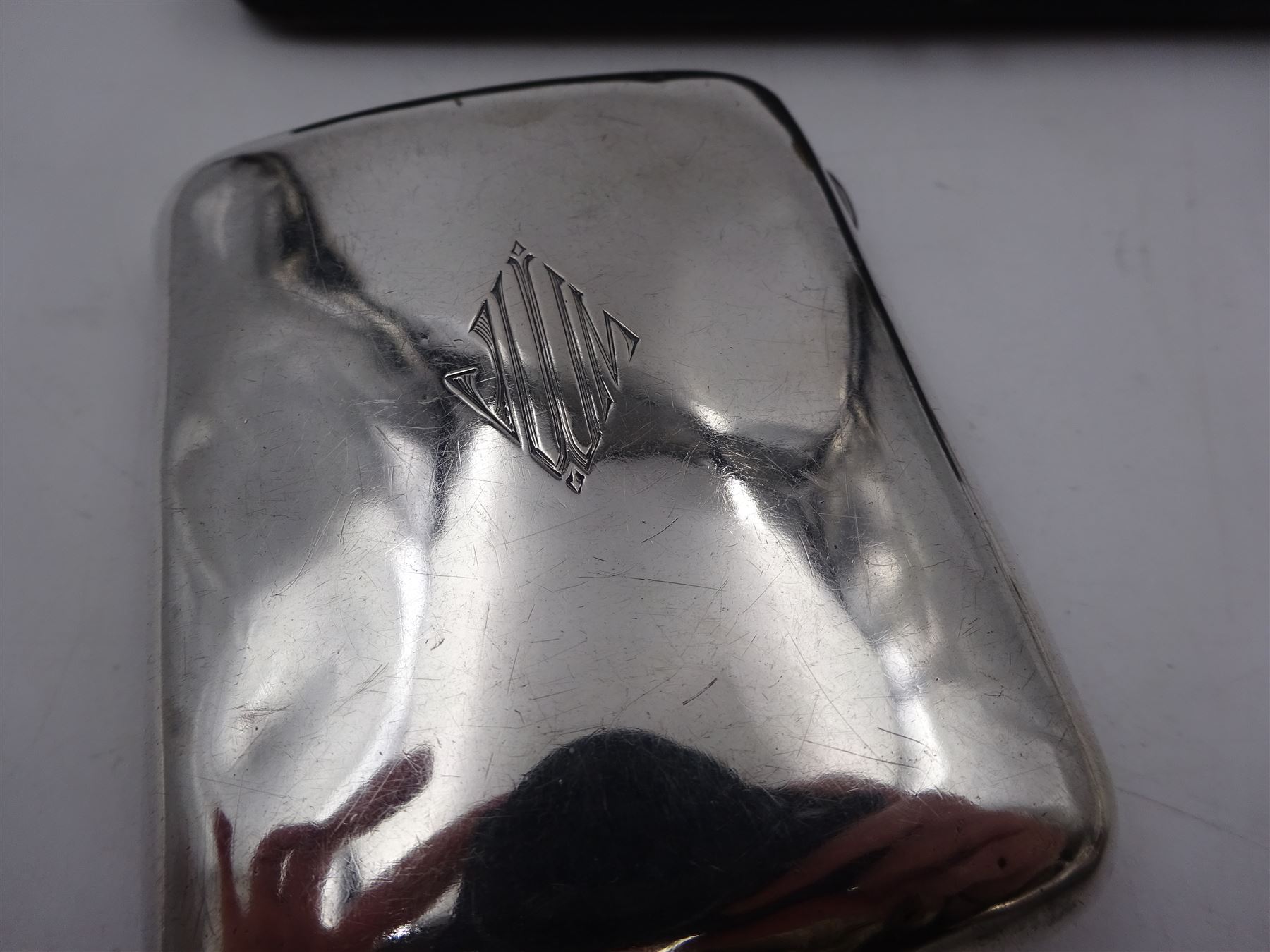 1920s silver cigarette case, of typical form, with engraved lozange to cover, hallmarked Charles Edwin Turner, Birmingham 1920, together with a pair of George III silver Old English pattern teaspoons, with engraved initials to terminal, hallmarked Peter, Ann & William Bateman, London 1803 and a cased spoon and pusher, hallmarked 