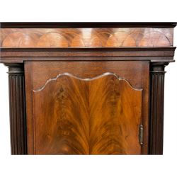 Penlington of Liverpool – early 19th century 8-day mahogany longcase clock, swans neck pediment with three turned wooden finials and verre eglomise panels, trunk with reeded columns and wavy topped door, plinth with canted corners on bracket feet, painted break-arch dial with Roman numerals and five-minute Arabic’s, centre sweep calendar and seconds hands, blue steel serpentine hands, signed beneath a painted rolling moon in the arch PENLINGTON, LIVERPOOL, eight day four pillar movement, anchor escapement and rack striking on a bell. With pendulum and weights.  The Penlington family were prolific clockmakers in 19th century Liverpool working from several addresses in the city, also recorded as chronometer and chronograph makers.