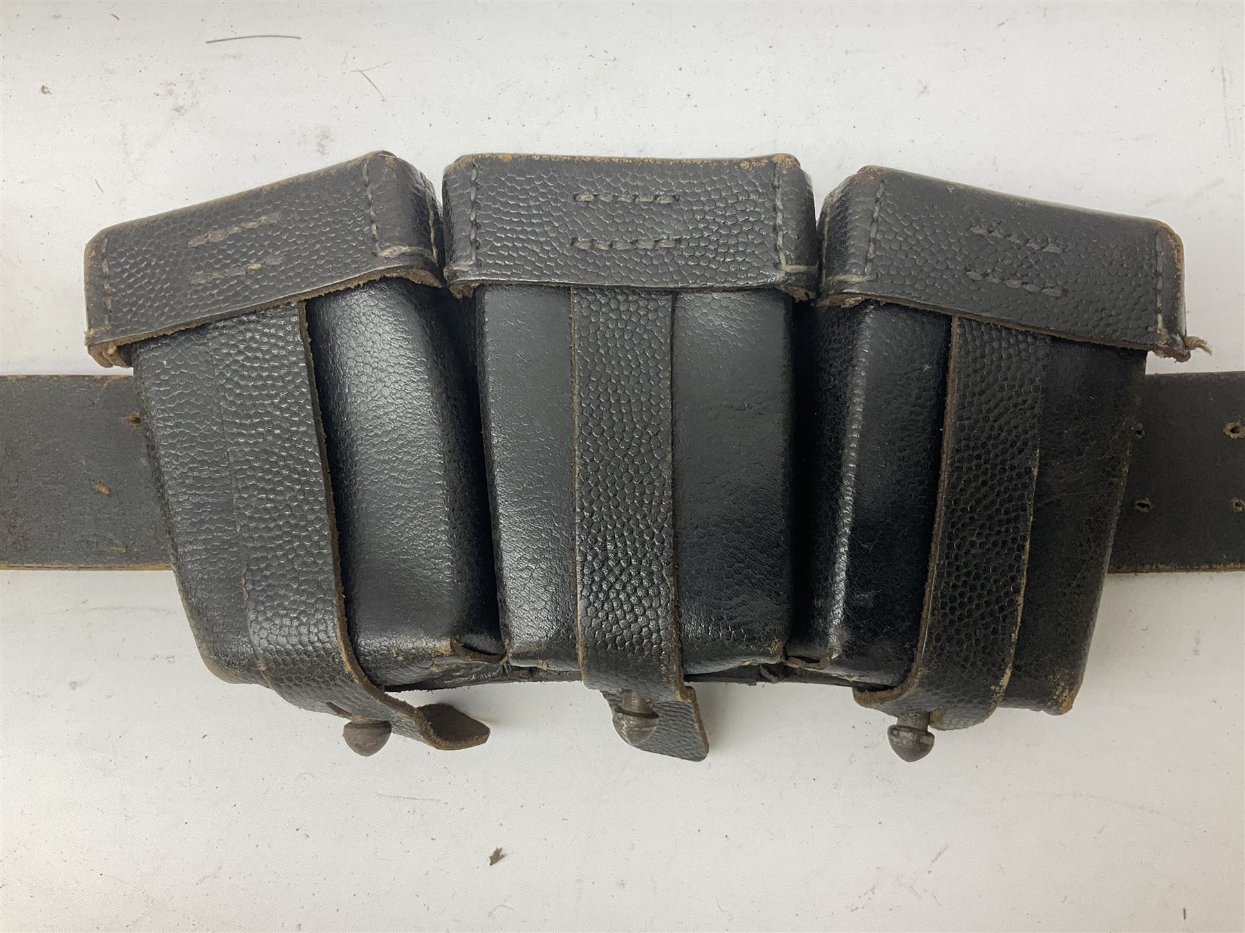 WW2 German 'SS' leather belt with six pouches (one containing unused field bandage) and buckle inscribed 'Meine Ehre Heifst Treue'; belt marked 0/0836 0029