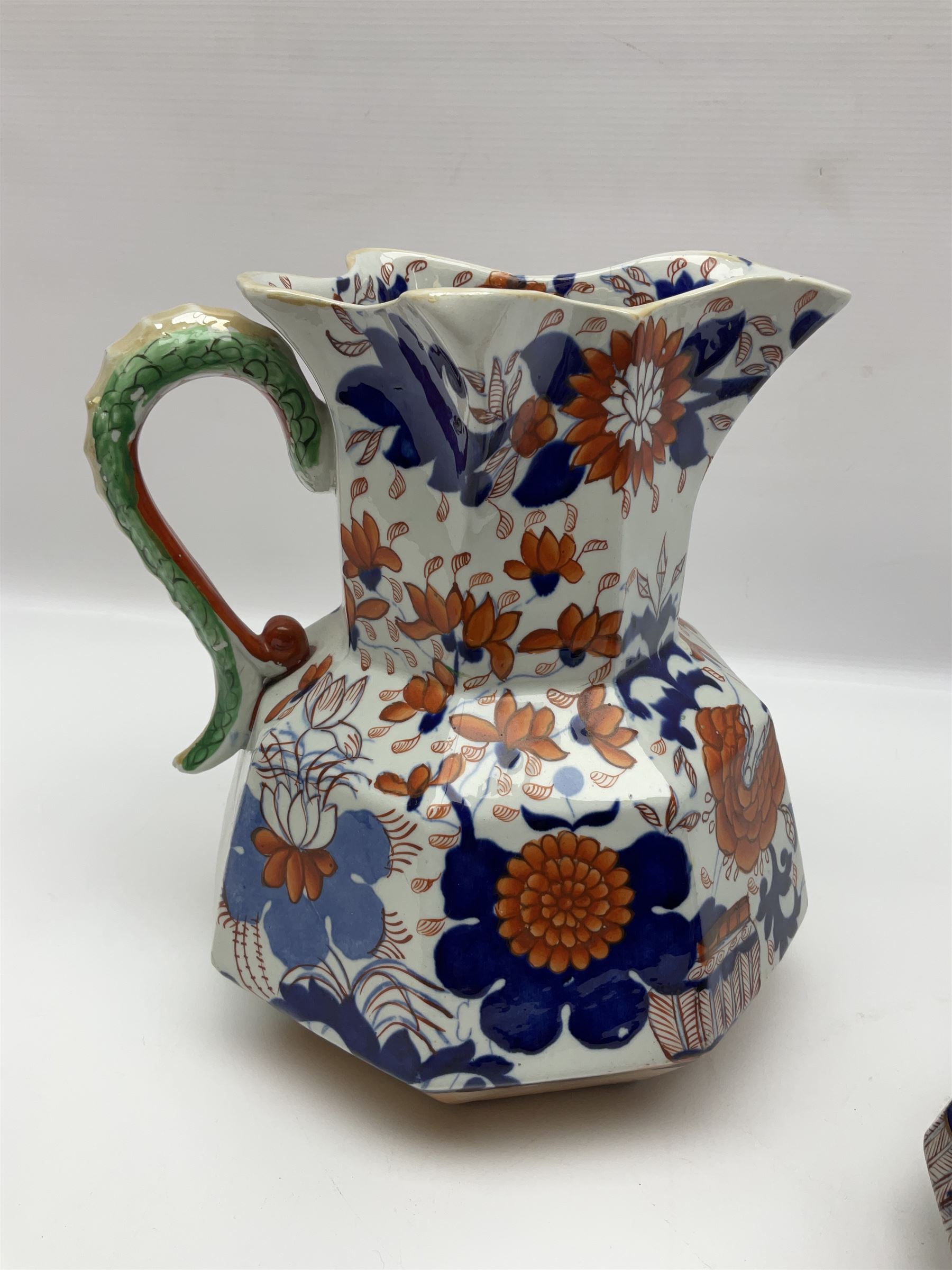 Two Masons Ironstone jugs, each in the Imari palette with serpent handles, with maker's mark beneath, tallest H24cm