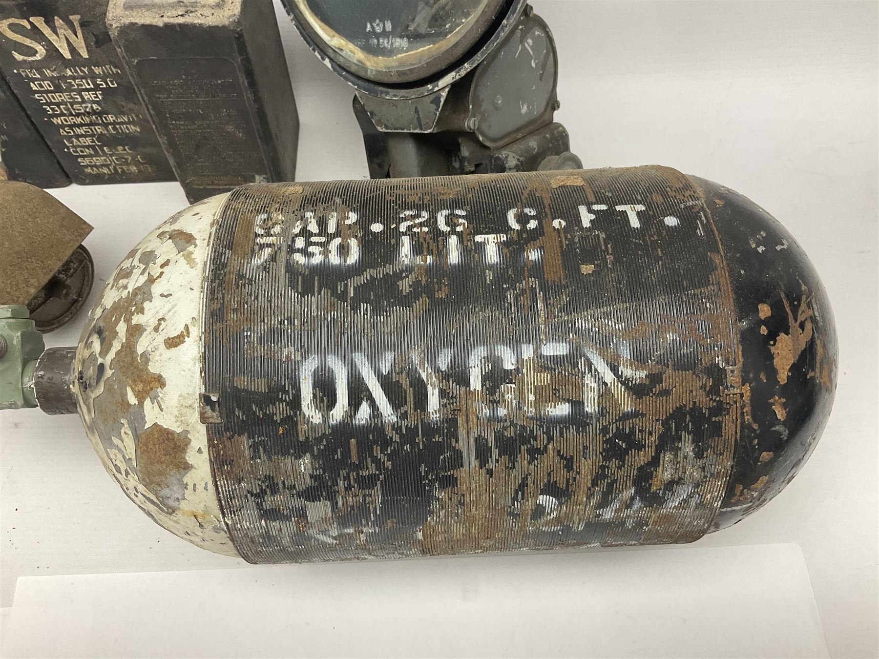 Three RAF light switches, together with military oxygen canister, batteries, gages etc  