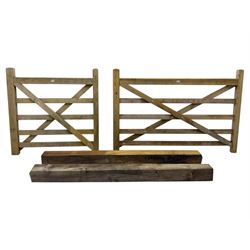 Two wooden gates with post hinges and latches