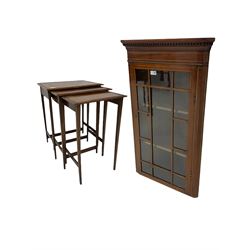 Edwardian mahogany wall hanging corner display cabinet, projecting dentil cornice over astragal glazed door (W56cm, H93cm), and an Edwardian mahogany nest of three tables (46cm x 36cm, H60cm)