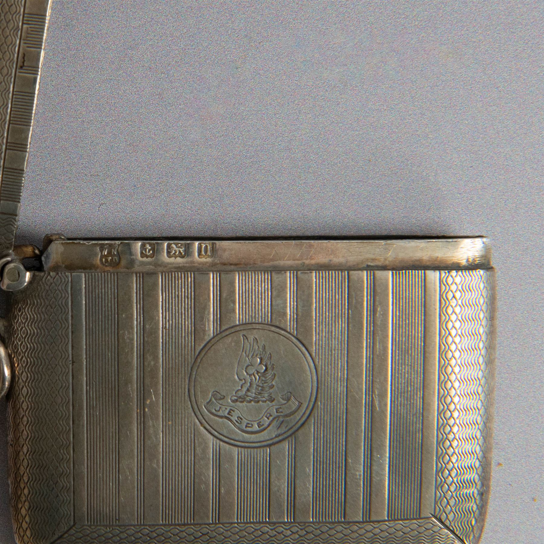 Two silver vesta cases, comprising early 20th century example with engine turned decoration, engraved 'J'espere' (I hope), hallmarked William Neale & Son Ltd, Birmingham 1912 and a small rectangular example with engraved decoration and initials, together with a small silver box, of plain circular form and a small silver scent bottle, all with import marks or A