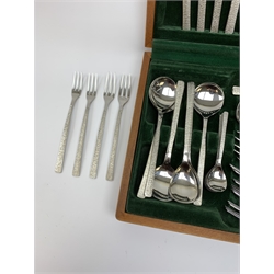 A canteen of bark effect stainless steel cutlery by Gerald Benney for Viners Studio, in a teak case. 