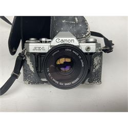 Canon AE-1 camera body, serial no 1124510 with 'Canon Lens FD 50mm 1:1.8 S.C' lens together with 'Hoya HMC Zoom 28-85mm lens, polaroid land camera instant 1000 etc
