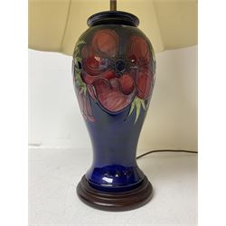 Moorcroft table lamp, of inverted baluster form, decorated in the Anemone pattern, on wooden plinth, with accompanying cream shade of lobed form, with piped detail, H36cm (excluding fitting)