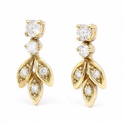 Pair of 18ct gold diamond leaf design earrings, each stud with diamond set leaves, suspending from two round brilliant cut diamonds, Sheffield import mark 1989, total diamond weight approx 0.40 carat