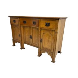 Early 20th century Arts & Crafts oak dresser, reverse break bow front top, fitted with three drawers, double cupboard and two single cupboards