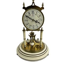 Mid-20th century Kundo torsion clock - Keininger & Obergfell German 400-day clock with a glass dome , enamel dial and pierced steel hands, arabic numerals and floral swags, movement supported by two pillars on a painted circular base, torsion suspension intact, with key.