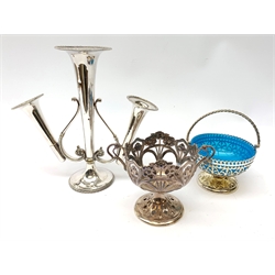  A WMF silver plated Art Nouveau pierced pedestal bowl, of circular form with twin handles, the bowl decorated with flowers and tendrils, stamped WMF, H12cm, together with a silver plated pierced pedestal bowl with swing handle and blue glass liner, and a silver plated epergne.   