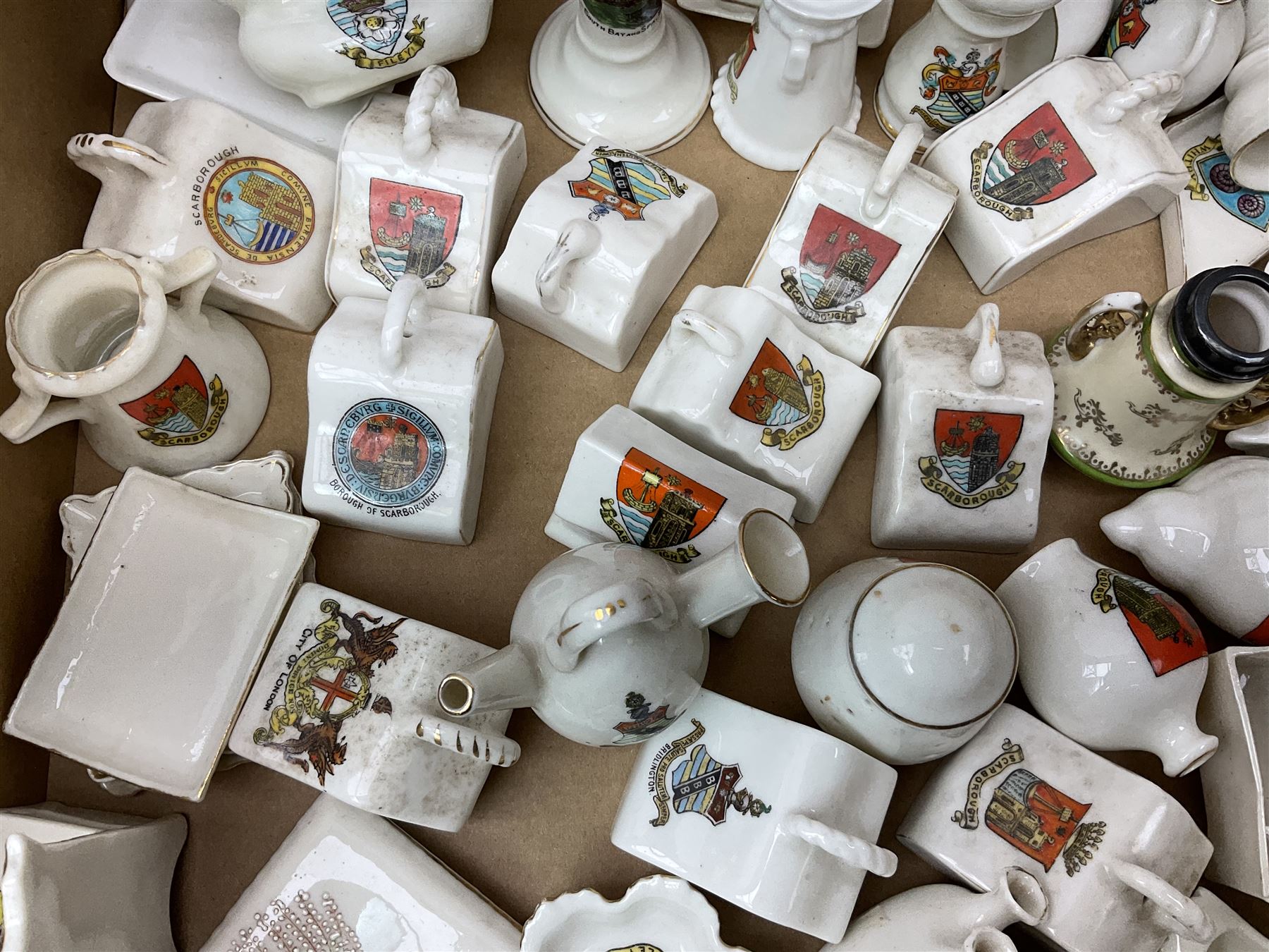 Collection of crested ware, to include Scarborough Willow Art coal truck, Whitby Willow Art Burns and Highland Mary figure group, Carlton China beer drinker 'Tak Hod an Sup Lad', and 'Here's ta me an'ma wife's usban', lighthouse, boat, Kingsway Art China Sir Walter Scott's Chair, butter dishes, candlestick, pianos etc