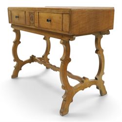 Leemings of Halifax (est. 1872) - Arts & Crafts oak side table, rectangular caddy top with raised moulded back, the frieze carved with central Yorkshire rose motif flanked by two drawers, raised on twin stylised lyre end supports formed of C-scrolls, united by shaped stretcher