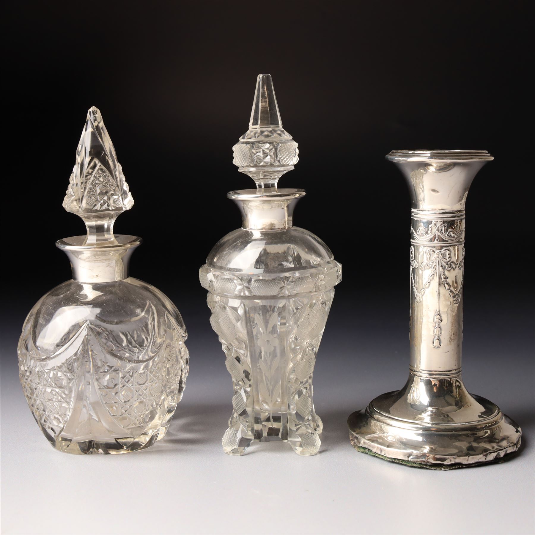 Silver upright photograph frame, aperture size 14cm x 9.5cm Birmingham 1919, pair of glass scent flasks with silver collars H16cm , two others, two dressing table jars with silver covers and a silver candlesticks