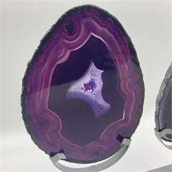 Pair of purple agate slices, polished with rough edges, raised upon silvered metal stands, H20cm