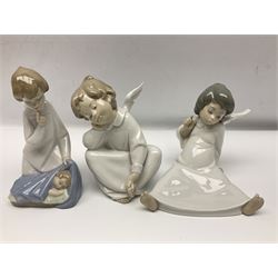 Four Lladro figures, comprising Wondering Angel no. 4962, Heavenly Chimes no. 5723,  Angel Dreaming no. 5961 and Angle with Child no.4635, largest H18cm 