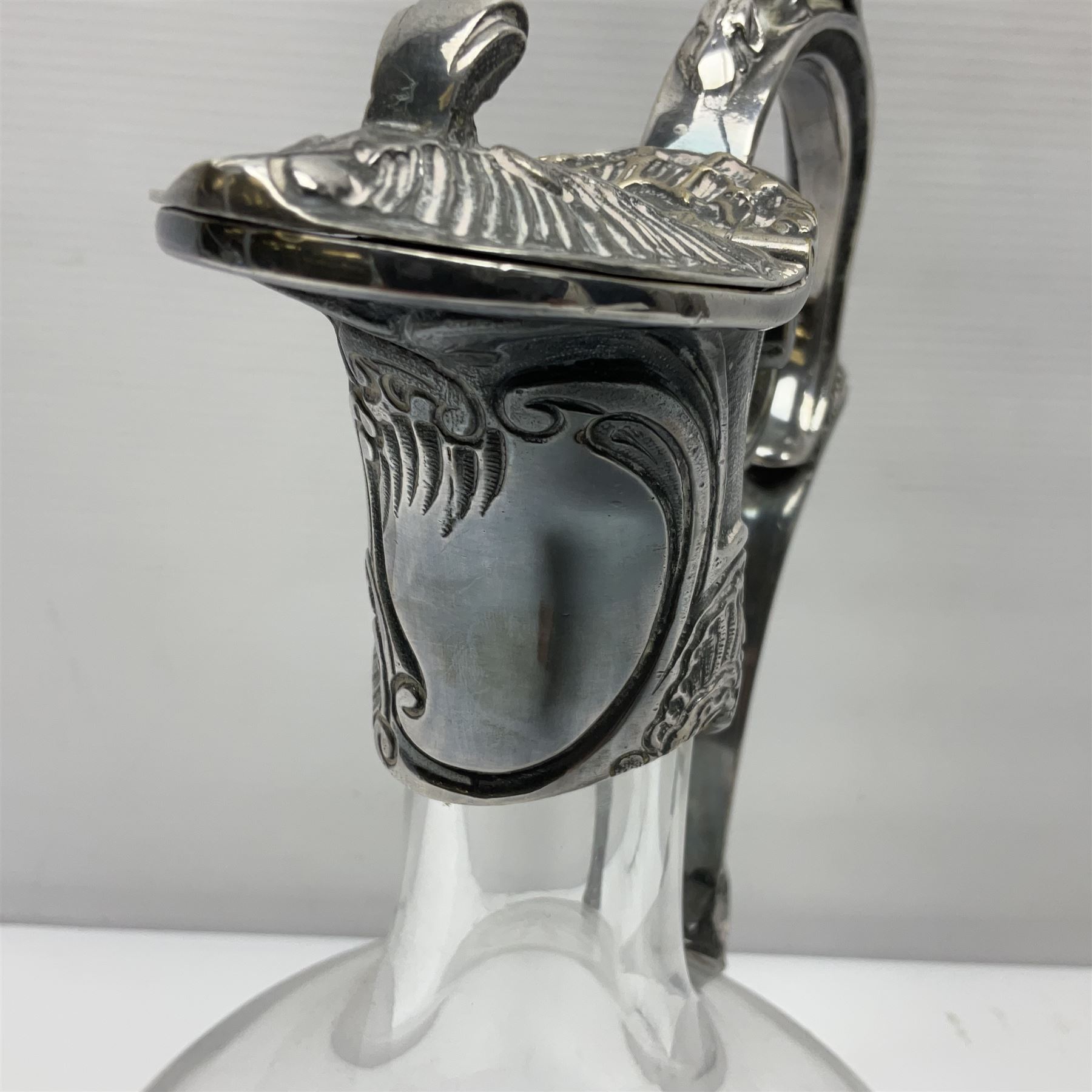 Silver plate mounted blue glass claret jug of ovid form, with C scroll handle, together with two other silver plate mounted claret jug